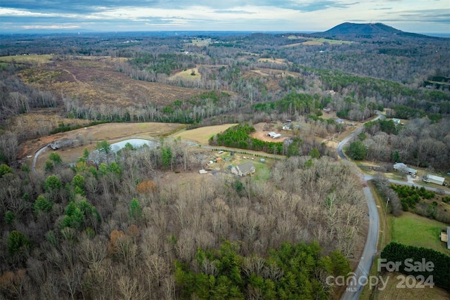 aerial view featuring a water and mountain view