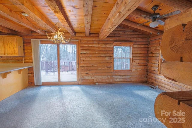 unfurnished living room with carpet flooring, wooden ceiling, and beam ceiling