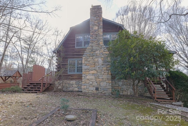 view of side of home with a deck