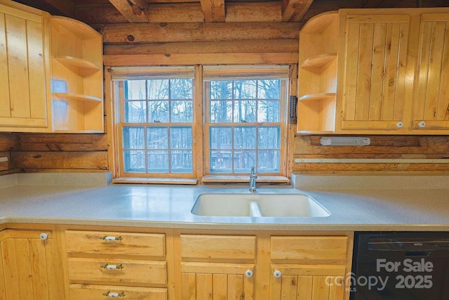 kitchen featuring rustic walls, black dishwasher, sink, and light brown cabinets