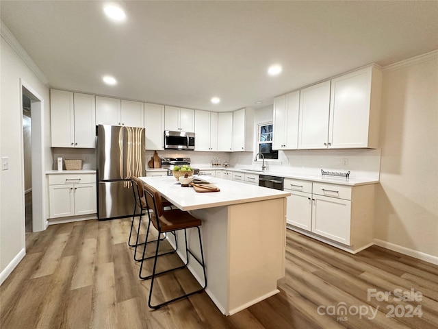 kitchen featuring white cabinets, appliances with stainless steel finishes, and a kitchen island