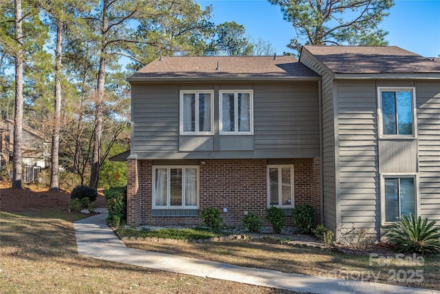 view of property exterior featuring a lawn