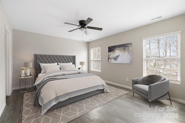 bedroom featuring ceiling fan and hardwood / wood-style flooring