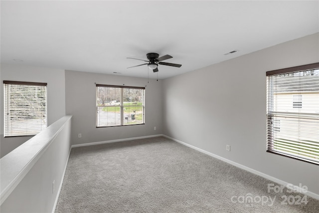 unfurnished room with carpet floors and ceiling fan