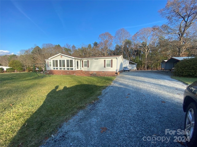 ranch-style house with a front yard