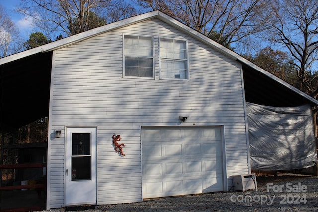 view of property exterior featuring a garage