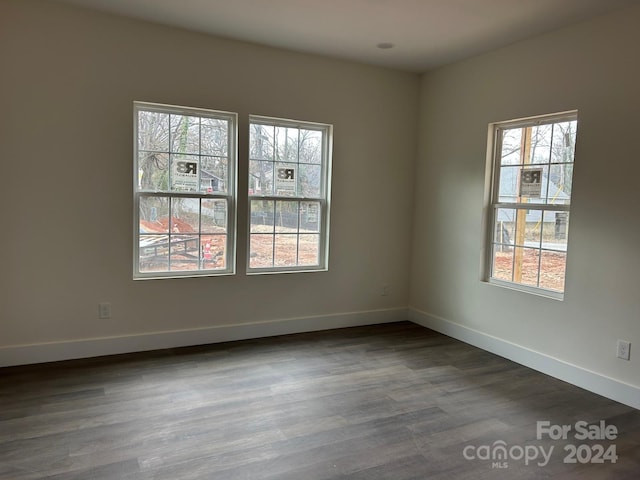 unfurnished room featuring dark hardwood / wood-style floors