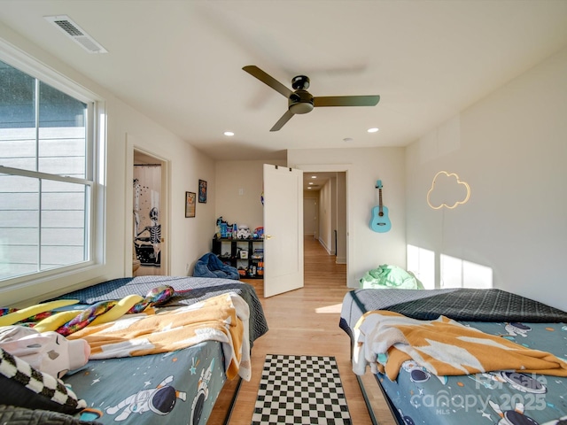 bedroom featuring recessed lighting, visible vents, light wood-style floors, and a ceiling fan