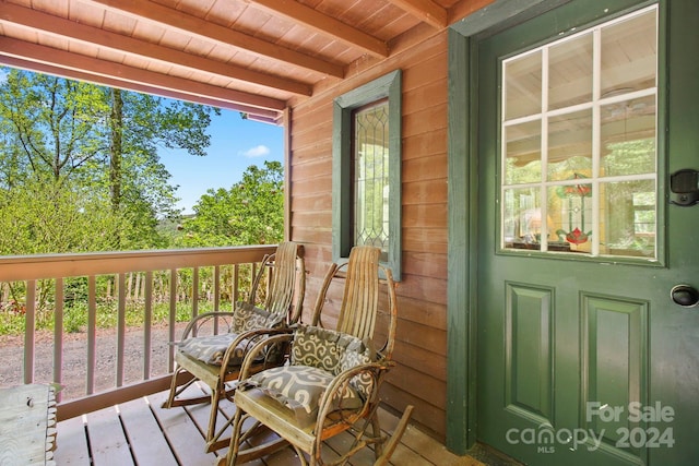 wooden terrace with a porch