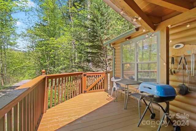 wooden terrace featuring grilling area