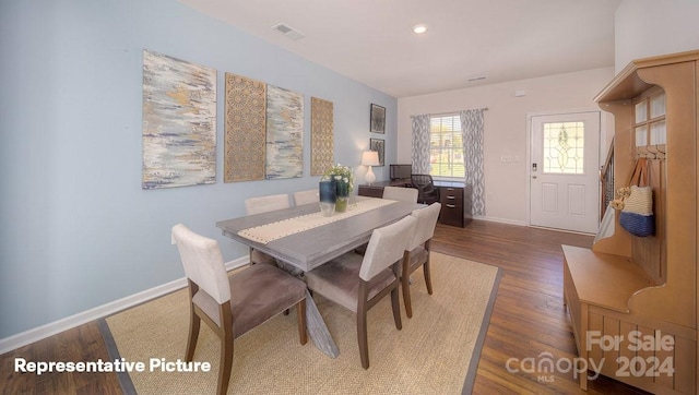 dining room with dark hardwood / wood-style flooring