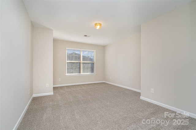 unfurnished room with light carpet