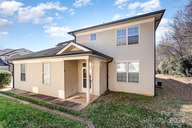 back of house with a patio area and central AC unit