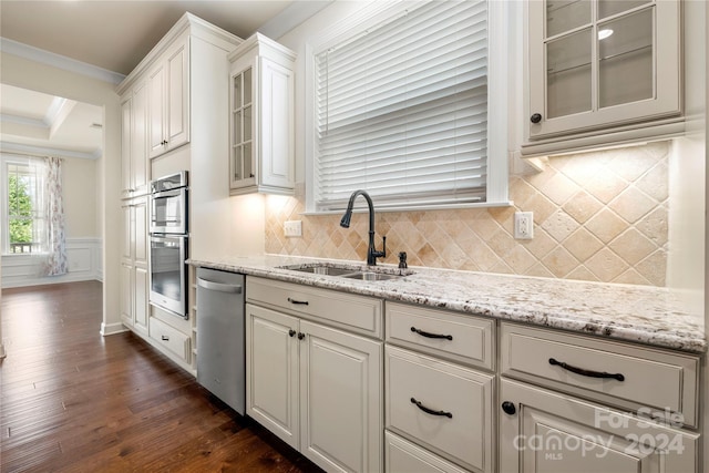 kitchen with sink, stainless steel appliances, dark hardwood / wood-style floors, crown molding, and white cabinets