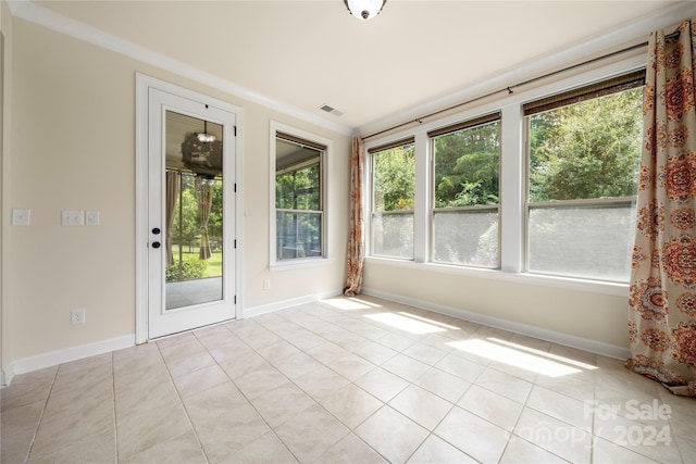 unfurnished sunroom featuring a healthy amount of sunlight