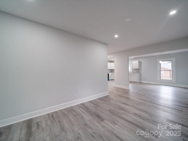 unfurnished room featuring light hardwood / wood-style floors