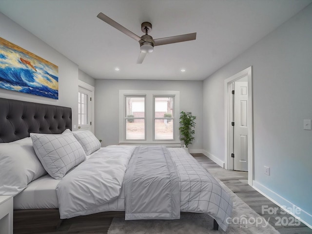 bedroom featuring ceiling fan and wood-type flooring