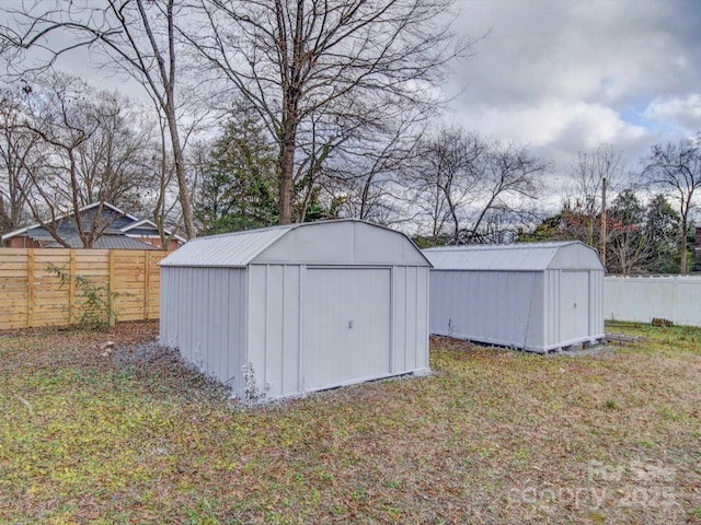 view of outbuilding with a lawn