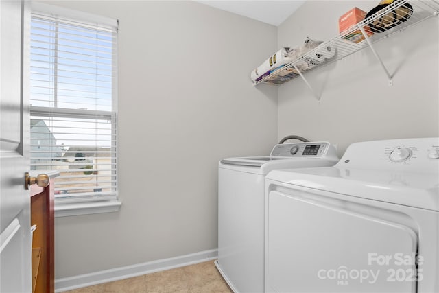 laundry room with washing machine and clothes dryer