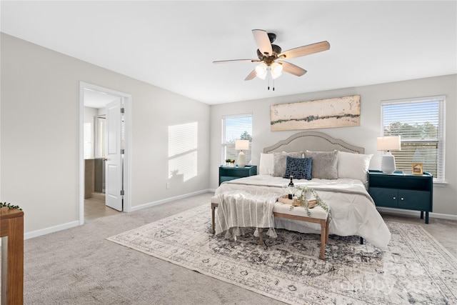 bedroom featuring light colored carpet and ceiling fan