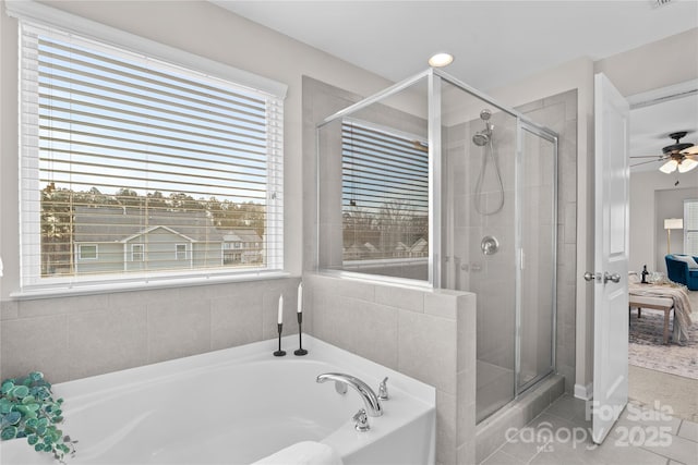 bathroom featuring plus walk in shower and tile patterned floors