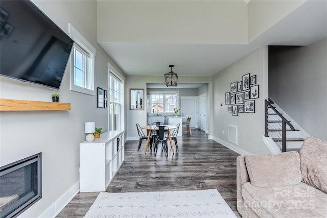 dining room featuring dark hardwood / wood-style floors and a notable chandelier