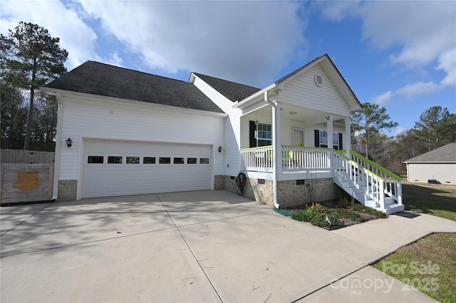 single story home featuring a garage and a porch