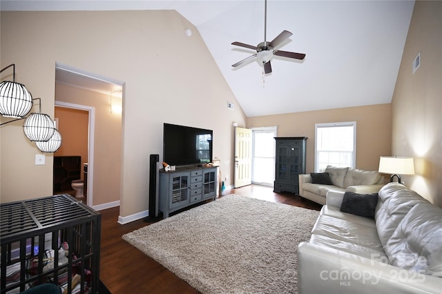 living room featuring ceiling fan, dark hardwood / wood-style floors, and high vaulted ceiling