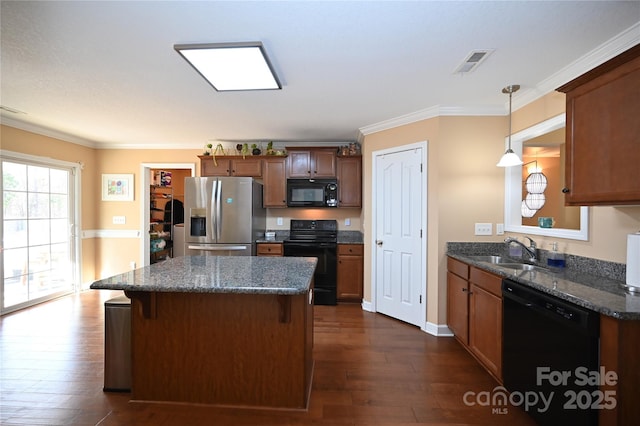 kitchen with sink, hanging light fixtures, dark hardwood / wood-style floors, and black appliances