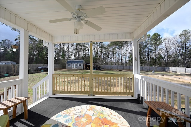 sunroom / solarium featuring ceiling fan and a wealth of natural light