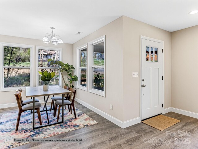 430 Hague Dr, Columbus, NC 28722 - dining room featuring baseboards, wood finished floors, a chandelier, and recessed lighting