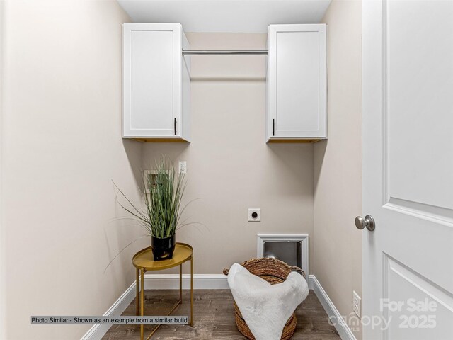 430 Hague Dr, Columbus, NC 28722 - laundry room with cabinet space, hookup for an electric dryer, wood finished floors, and baseboards