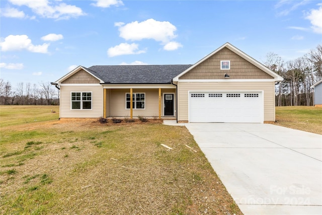 view of front facade featuring a garage and a front lawn