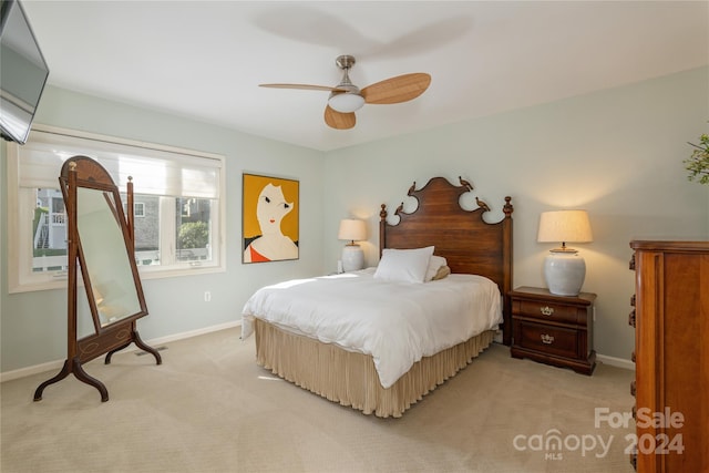 carpeted bedroom featuring ceiling fan