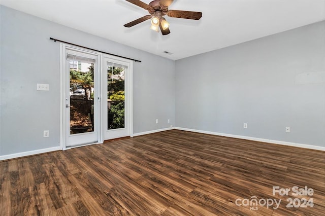 empty room with hardwood / wood-style flooring and ceiling fan