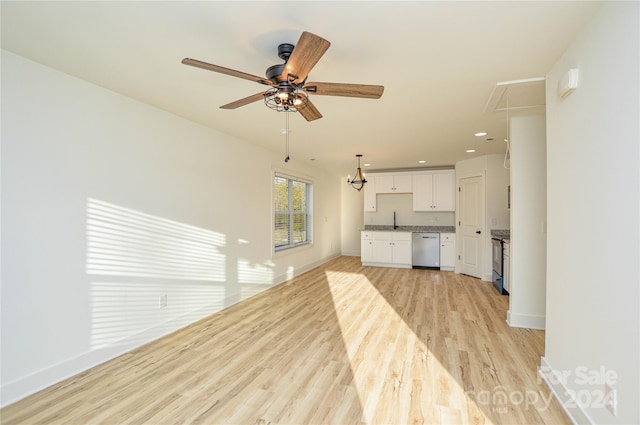 unfurnished living room featuring ceiling fan, light wood-type flooring, and sink