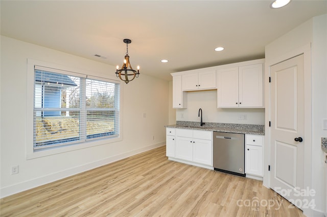 kitchen featuring an inviting chandelier, sink, stainless steel dishwasher, light hardwood / wood-style floors, and white cabinetry