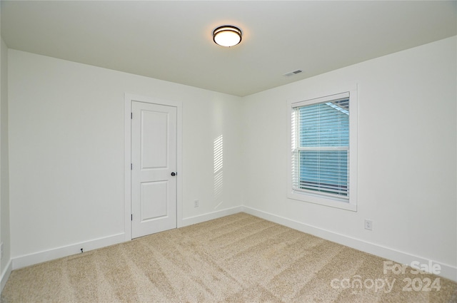 empty room with carpet flooring