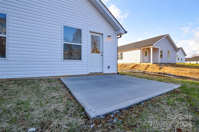 doorway to property with a patio area