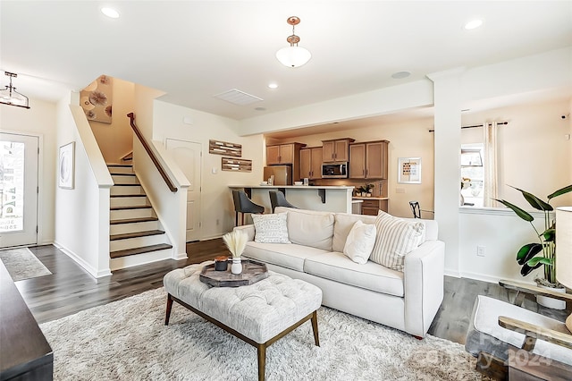 living room with dark hardwood / wood-style floors