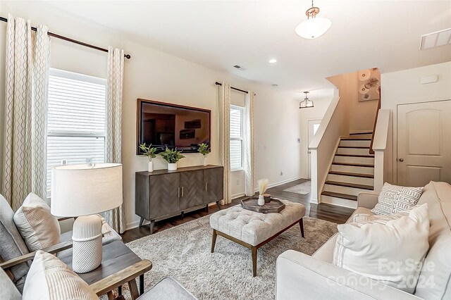 living room with dark wood-type flooring