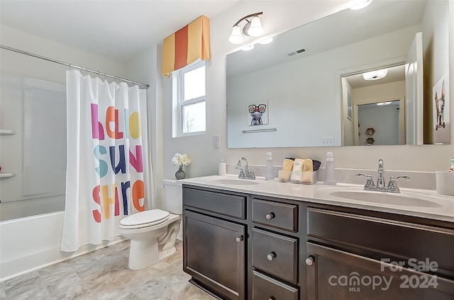 full bathroom featuring shower / tub combo, vanity, and toilet