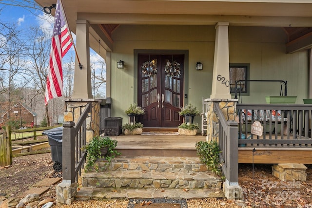 property entrance featuring central AC unit and covered porch