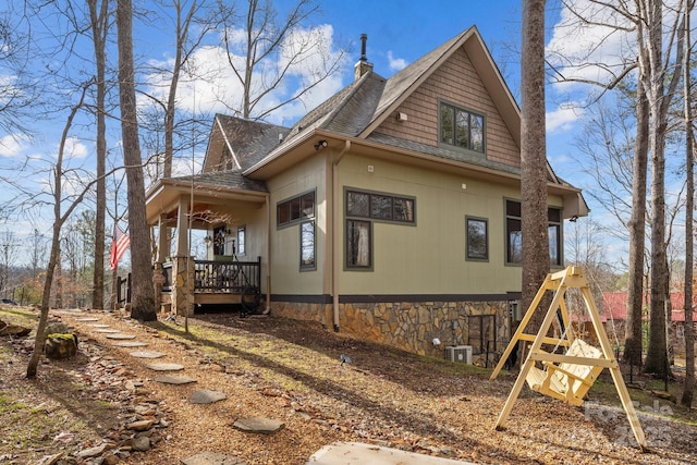 view of property exterior with covered porch