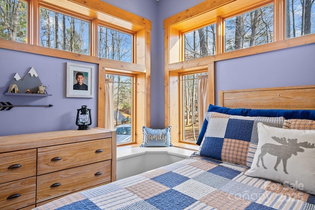 bedroom featuring a towering ceiling