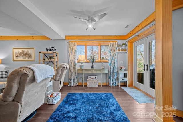 living area featuring dark hardwood / wood-style floors, ceiling fan, and french doors