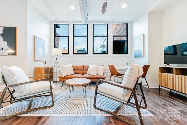 living room with hardwood / wood-style floors and ceiling fan