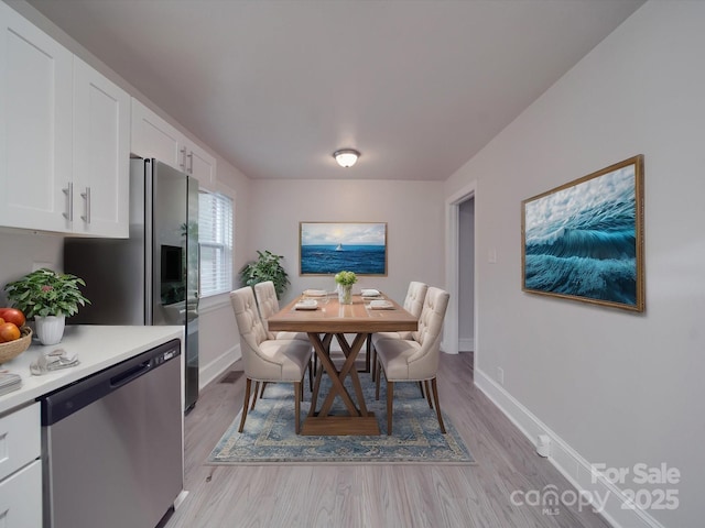 dining room featuring light wood-type flooring