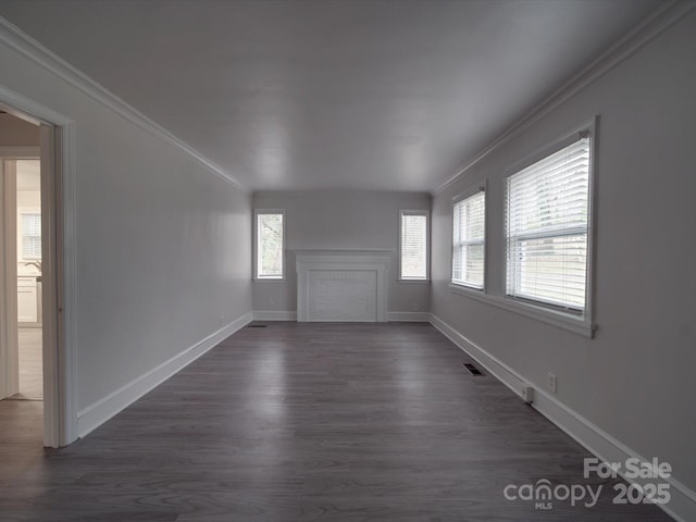 interior space featuring crown molding and dark hardwood / wood-style flooring