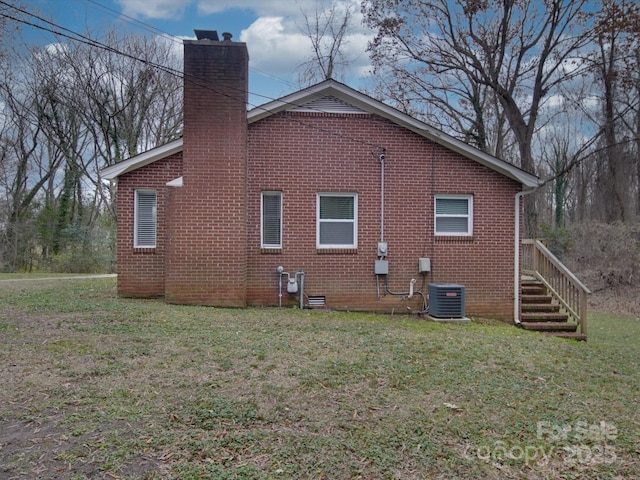 view of property exterior featuring cooling unit and a lawn